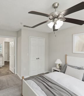 Model Bedroom with Carpet and attached Bathroom at Shadow Ridge Apartments in Riverdale, GA-SMLAM.