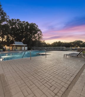 Community Swimming Pool with Pool Furniture at Walden Lake Apartments in Plant City, FL-SMLAM.
