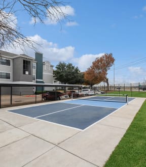 Community Sports Court with Nets at Bridges at Oakbend Apartments in Lewisville, TX