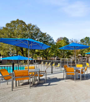 Lounge chairs and umbrellas by the pool.