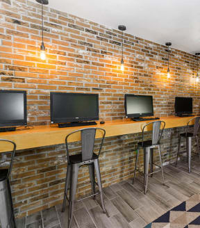 Business center with computers tables and chairs