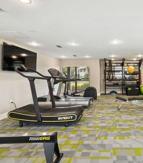 Fitness center at Arbors at Orange Park Apartments in Orange Park, Florida.