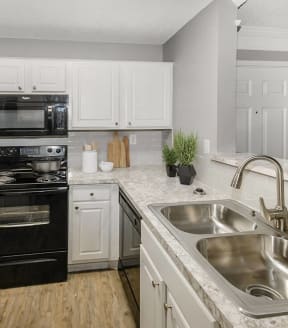 Model kitchen at Aspen Court Apartments in Arlington, Texas