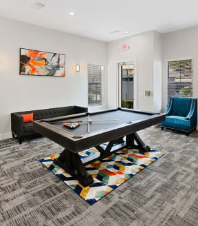 Game room at The Belmont at Duck Creek Apartments in Garland, TX.