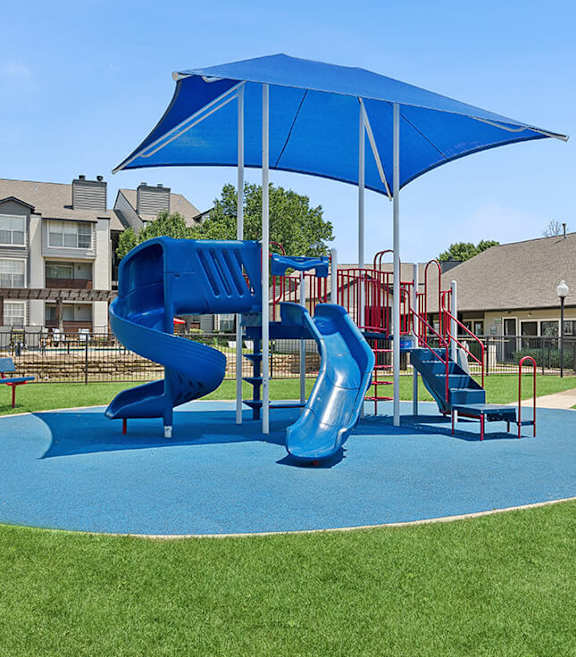 Community Playground with Two Slides at Cobblestone Apartments located in Arlington, TX-SMLAM.