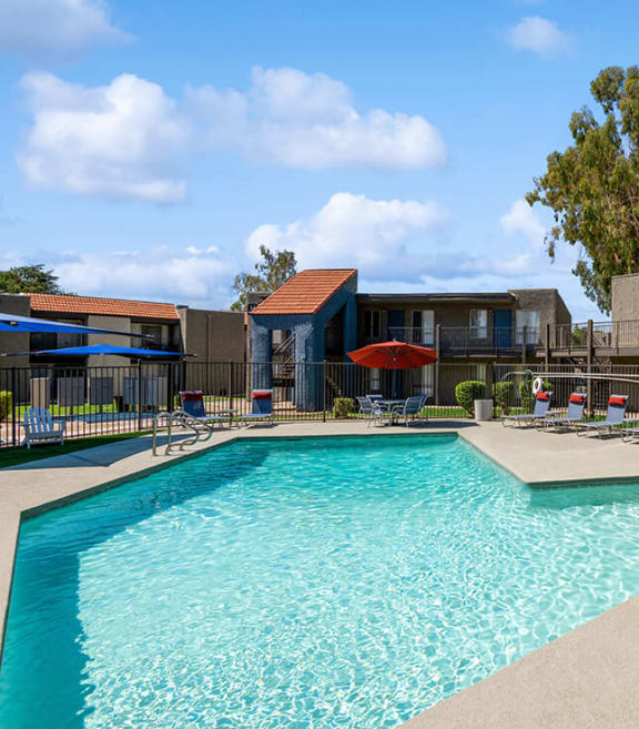 Community Swimming Pool with Pool Furniture at Villages at Metro Center located in Phoenix, AZ-SMLAM.