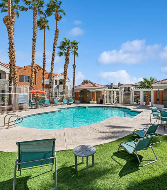 Community Swimming Pool with Pool Furniture at Stonegate Apartments located in Las Vegas, NV-SMLAM.