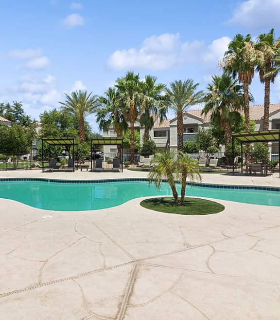 Community Swimming Pool with Pool Furniture at Monterra Apartments located in Las Vegas, NV-SMLAM.