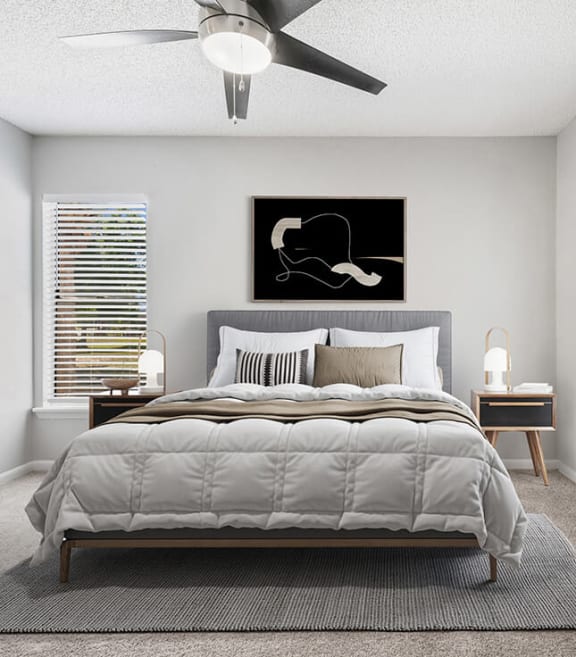 Model Bedroom with Carpet and Patio Accessibility at Rosehill Preserve Apartments located in Orlando, FL-SMLAM.