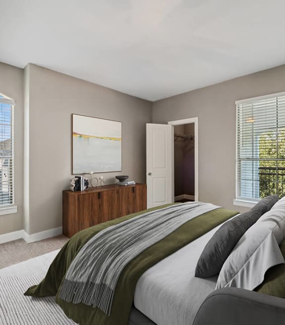 Model Bedroom with Carpet and Window Views at Park West Apartments located in Houston, TX-SMLAM.