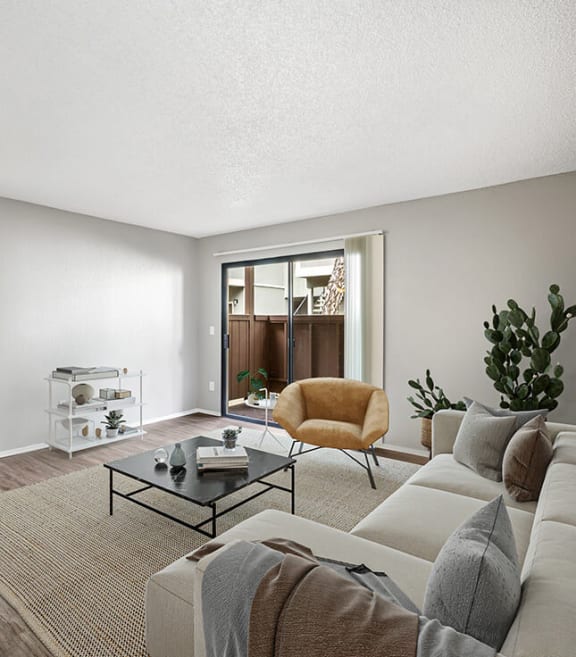 Model Living Room with Carpet and Patio Accessibility at Meritage Apartments in Vallejo, CA-SMLAM.
