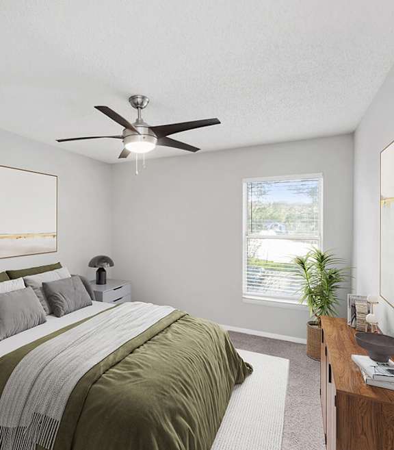 Model Bedroom with Carpet and Window View at Vue at Baymeadows Apartments located in Jacksonville, FL-SMLAM.