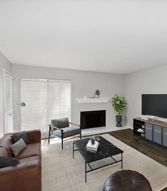 Model Living Room with Carpet and Fireplace at Summit Ridge Apartments located in Arlington, TX-SMLAM.