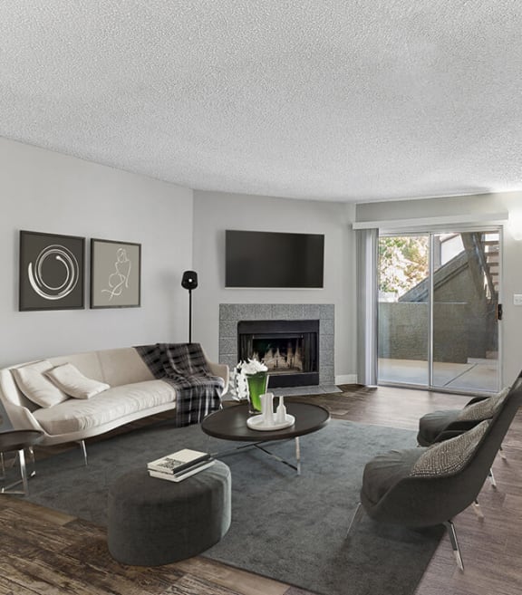 Model Living Room with Wood-Style Flooring at Meadow Ridge Apartments in Las Vegas, NV