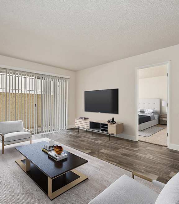 Model Living Room with Wood-Style Flooring and Patio Accessibility at Butler Ridge Apartments located in Glendale, AZ-SMLAM.