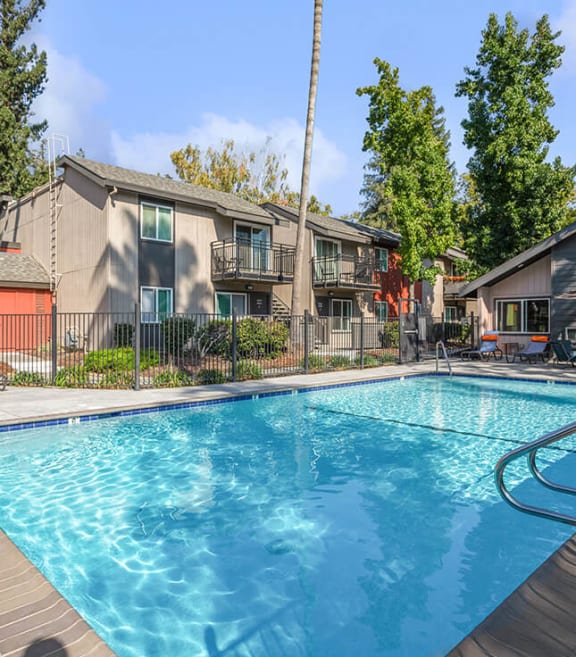 Community Swimming Pool with Pool Furniture at The Archer Apartments in Sacramento, CA-SMLAM.