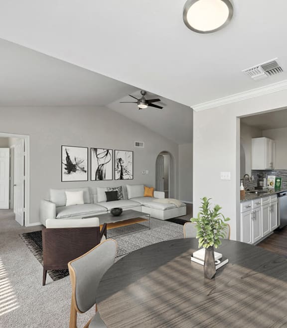 Model Dining Room with Carpet and View of Kitchen and Living Room at Hidden Creek Apartments in Lewisville, TX-SMLAM.