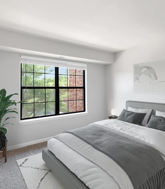 Model Bedroom with Carpet and Window View at Brightwood Forest Apartments in Dale City, VA-SMLAM.