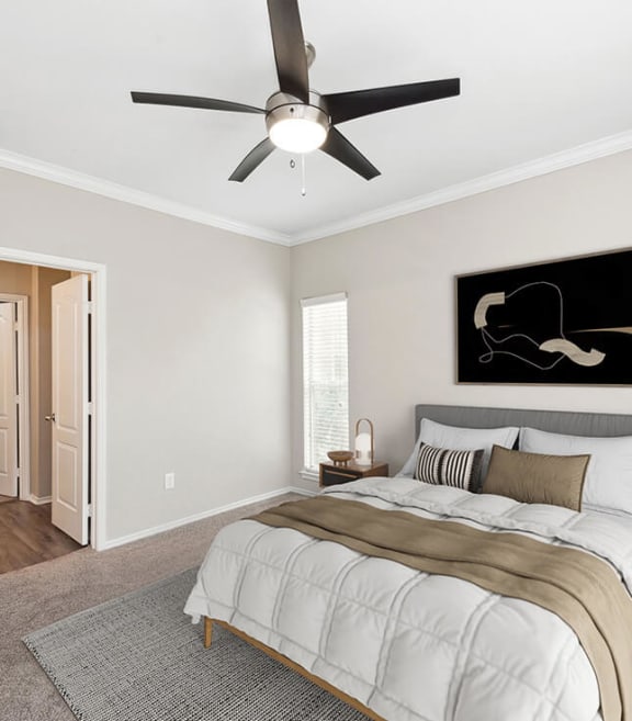 Model Bedroom with Carpet and Window View at Allure North Dallas Apartments located in Dallas, TX-SMLAM.