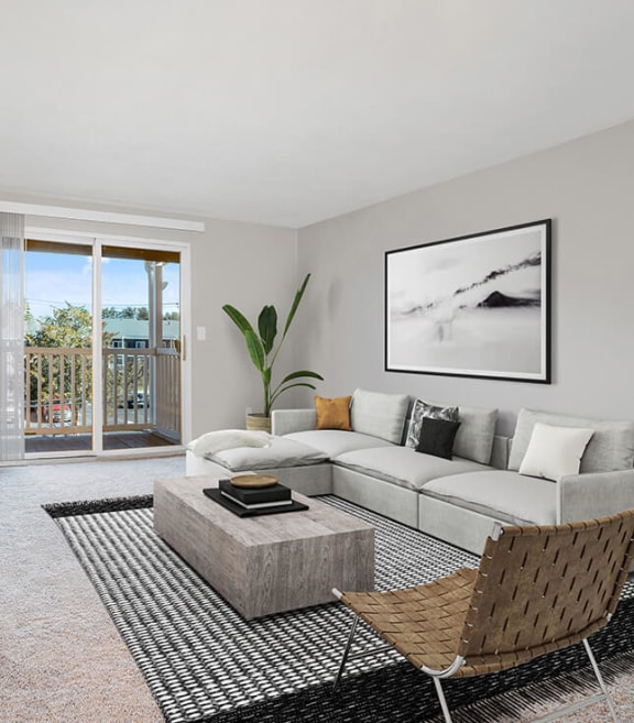 Model Living Room with Carpet and Patio Accessibility at Stone Ends Apartments in Stoughton, MA-SMLAM.