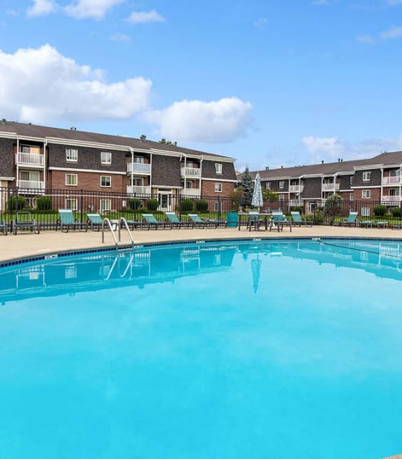 Community Swimming Pool with Pool Furniture at Stone Ends Apartments in Stoughton, MA-SMLAM.