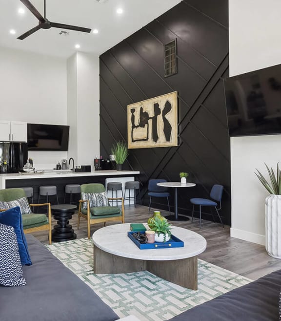 Community Clubhouse with Lounge Furniture, TV & Kitchenette Area at Monterra Apartments located in Las Vegas, NV-SMLAM.