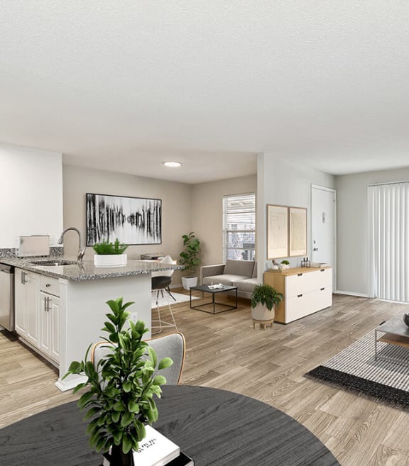 Model Dining Room with Wood-Style Flooring at Seven Lakes at Carrollwood Apartments in Tampa, FL