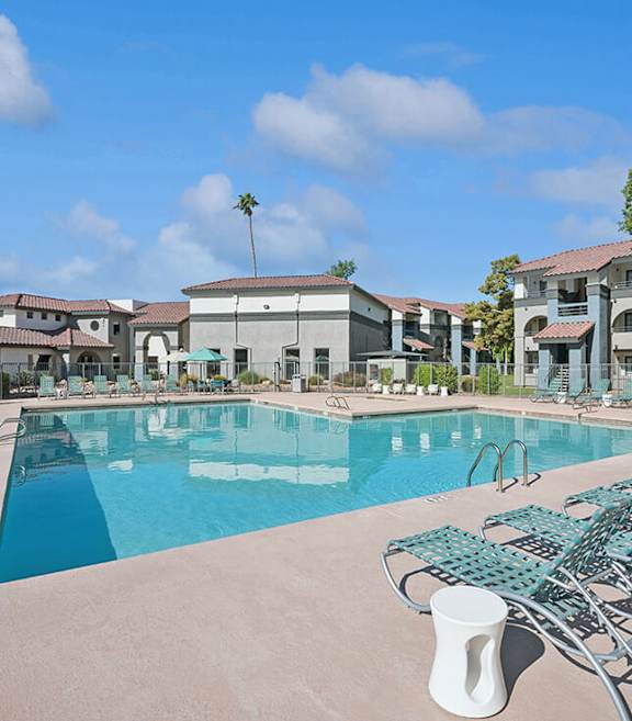 Community Swimming Pool with Pool Furniture at Stillwater Apartments located in Glendale, AZ-SMLAM.
