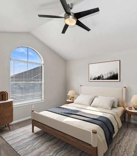 Model Bedroom with Carpet and Window View at Hidden Creek Apartments in Lewisville, TX-SMLAM.
