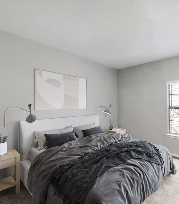 Model Bedroom with Carpet and Window View at Bridges at Oakbend Apartments located in Lewisville, TX-SMLAM.