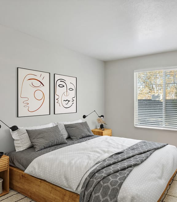Model Bedroom with Carpet and Window View at Broadmoor Village Apartments located in West Jordan, UT-SMLAM.