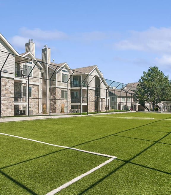 Community Soccer Field with Nets at Broadmoor Village Apartments located in West Jordan, UT-SMLAM.
