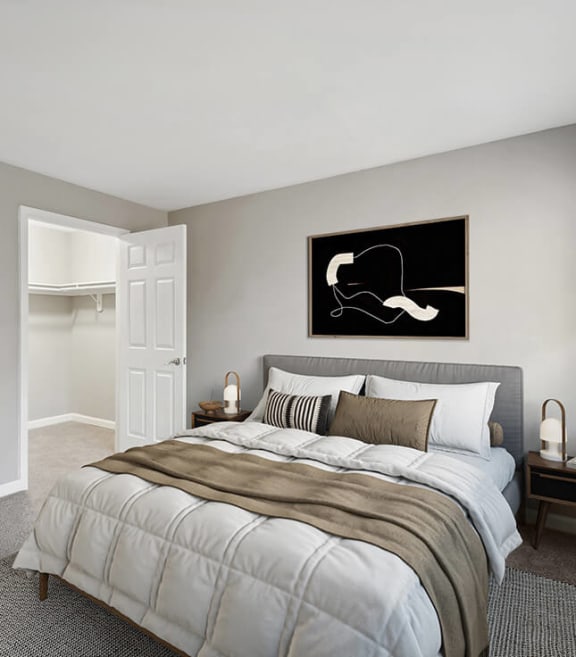 Model Bedroom with Carpet and Walk In Closet at Spring Forest Apartments in Raleigh, NC-SMLAM.