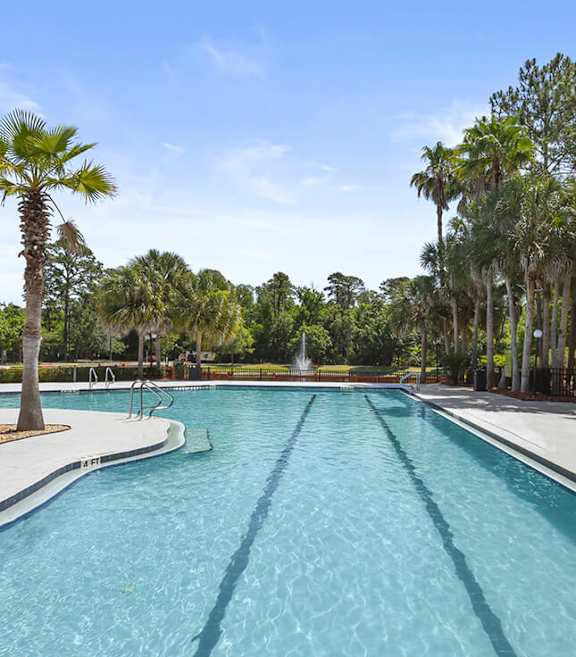 Community Swimming Pool with Pool Furniture at Mirage on Kernan Apartments located in Jacksonville, FL-SMLAM.