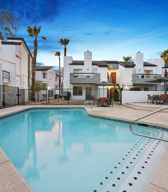 Community Swimming Pool with Pool Furniture at Crystal Creek Apartments in Phoenix, AZ-SMLAM.
