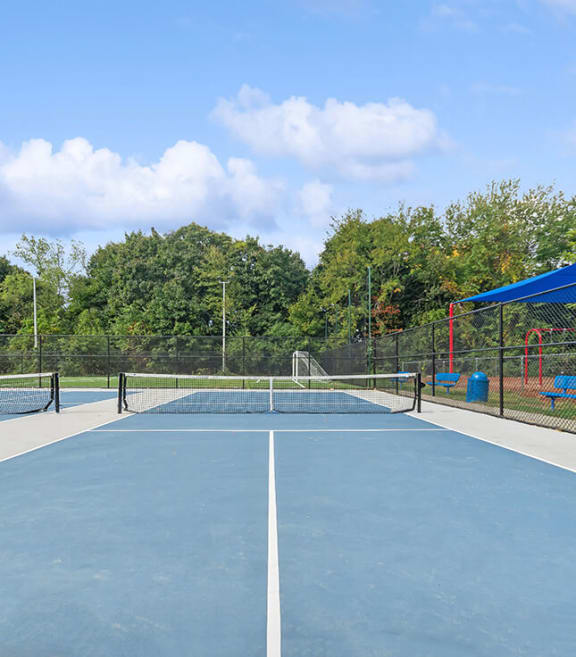 Community Pickleball Courts with Nets at Heights at Marlborough Apartments located in Marlborough, MA-SMLAM.