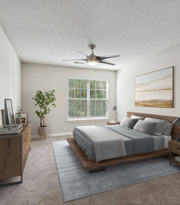 Model Bedroom with Carpet and Window View at Retreat at Stonecrest Apartments located in Lithonia, GA-SMLAM.