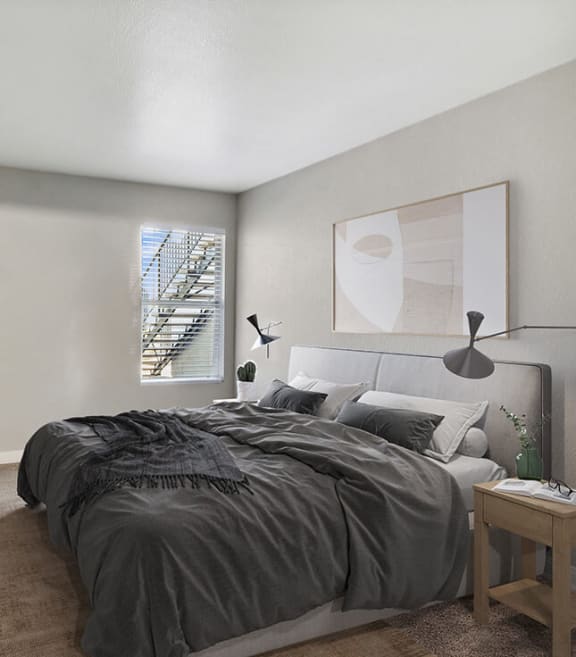 Model Bedroom with Carpet and Window View at Monterra Apartments located in Las Vegas, NV-SMLAM.