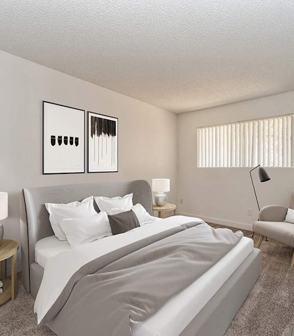 Model Bedroom with Carpet and Window View at Palmilla Apartments located in San Diego, CA.