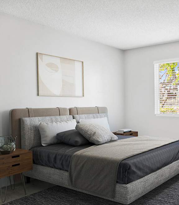 Model Bedroom with Carpet and Window View at Cove La Mesa Apartments located in La Mesa, CA-SMLAM.