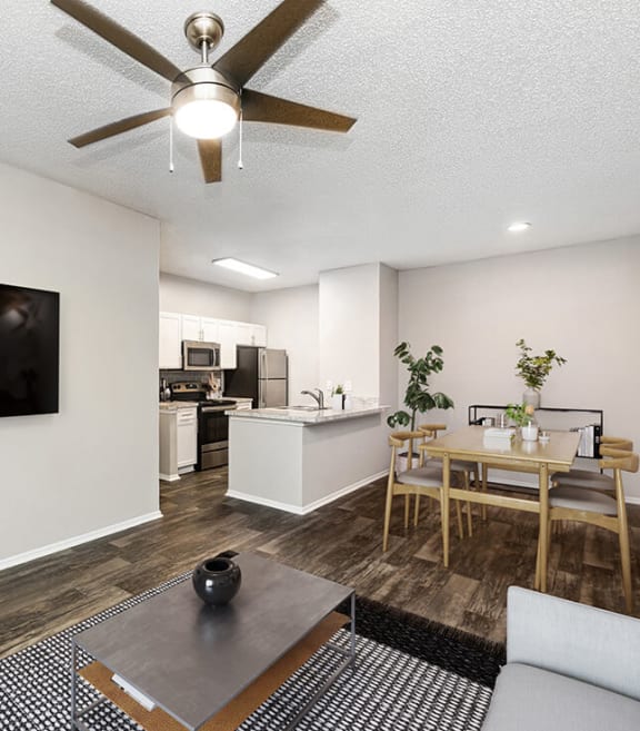 Model Living Room with Wood-Style Flooring at Dallas North Park Apartments in Dallas, TX-SMLAM.