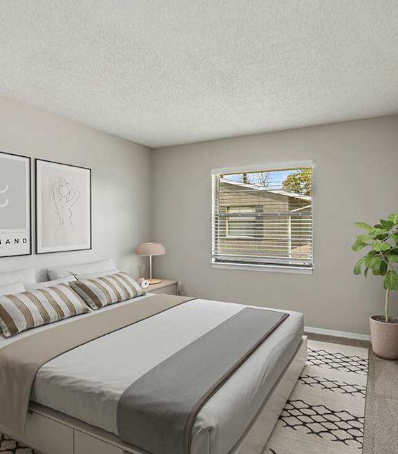 Model Bedroom with Carpet and Window View at Arbors at Orange Park Apartments located in Orange, Park FL-SMLAM.