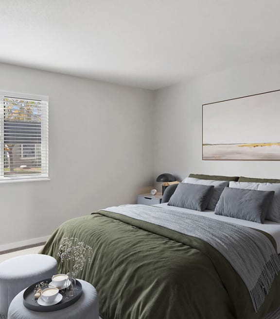 Model Bedroom with Carpet and Window View at Overlook Apartments located in Salt Lake City, UT-SMLAM.