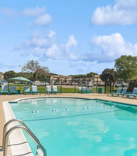 Community Swimming Pool with Pool Furniture at Meadows at Marlborough Apartments located in Marlborough, MA-SMLAM.