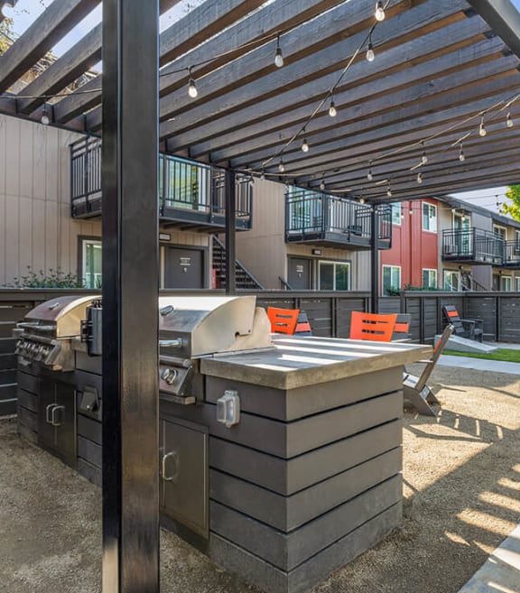 Outdoor BBQ Area with Furniture at The Archer Apartments in Sacramento, CA-SMLAM.