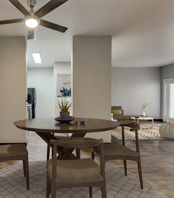 Model Dining Room with Wood-Style Flooring and View of Kitchen at Landings at Morrison Apartments located in Gresham, OR-SMLAM.