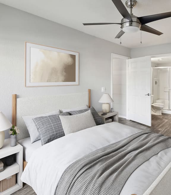 Model Bedroom with Carpet and Attached Bathroom at Ridgeline Apartments in Tucson, AZ-SMLAM.