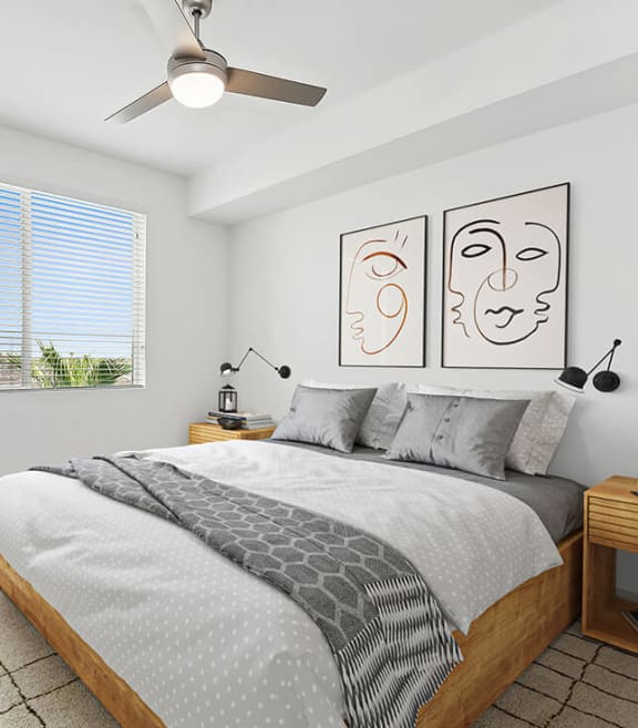 Model Bedroom with Carpet and Window View at Parc Roundtree Ranch Apartments located in Peoria, AZ-SMLAM.