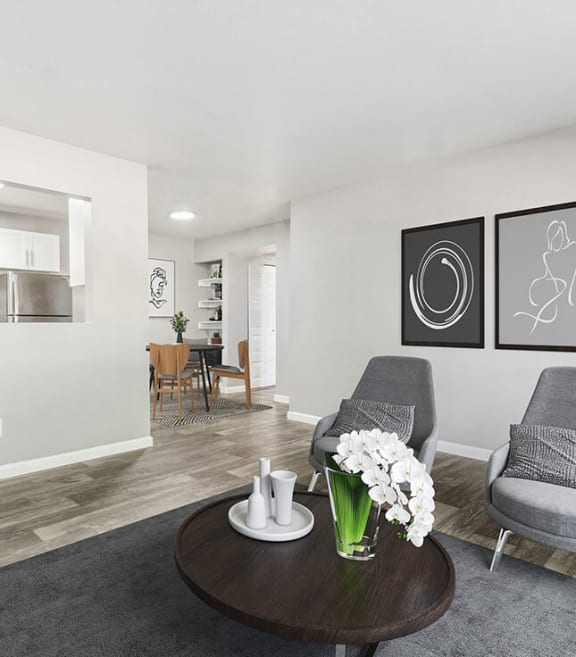 Model Living Room with Wood-Style Flooring at Lore at South Mountain Apartments located in Ahwatukee, AZ-SMLAM.
