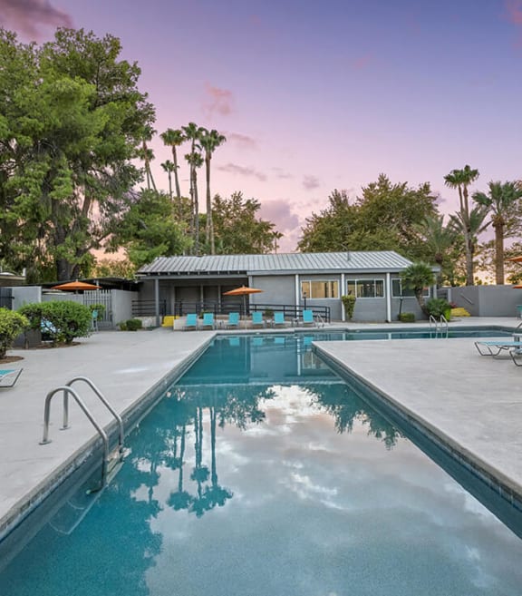 Community Swimming Pool with Pool Furniture at Lakeside Casitas Apartments located in Tucson, AZ-SMLAM.